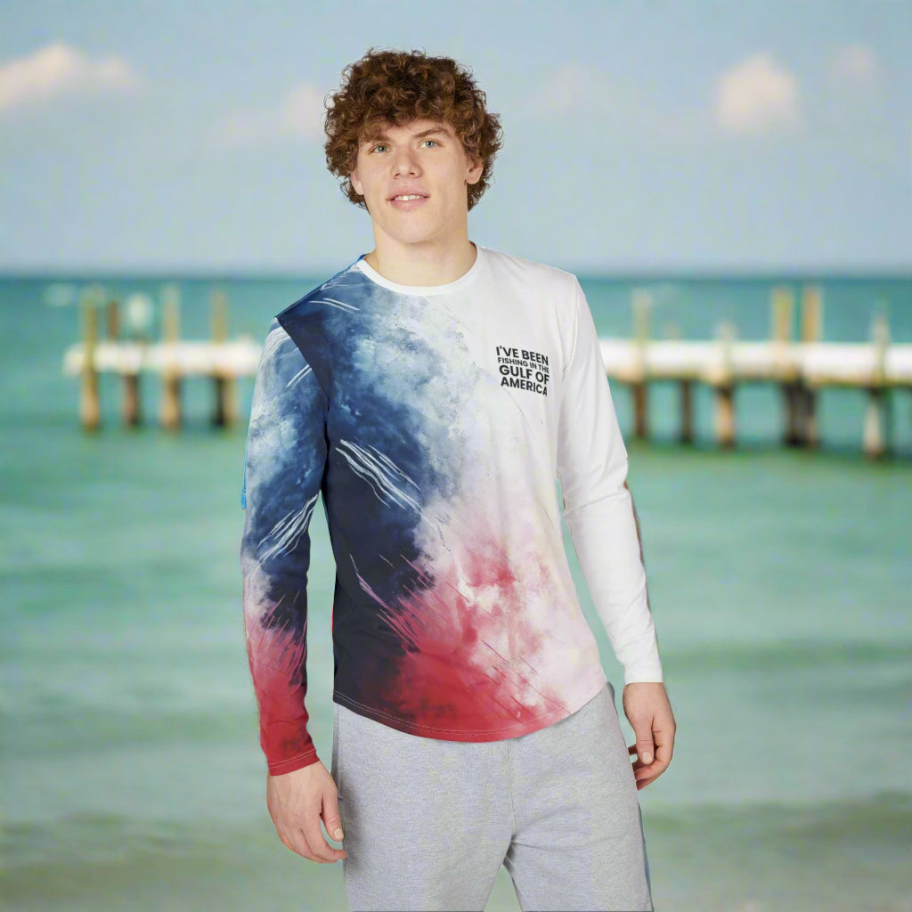 Men’s patriotic UV protection long sleeve fishing shirt featuring red, white, and blue colors with “I’ve Been Fishing the Gulf of America” text, worn by an angler on the Gulf Coast